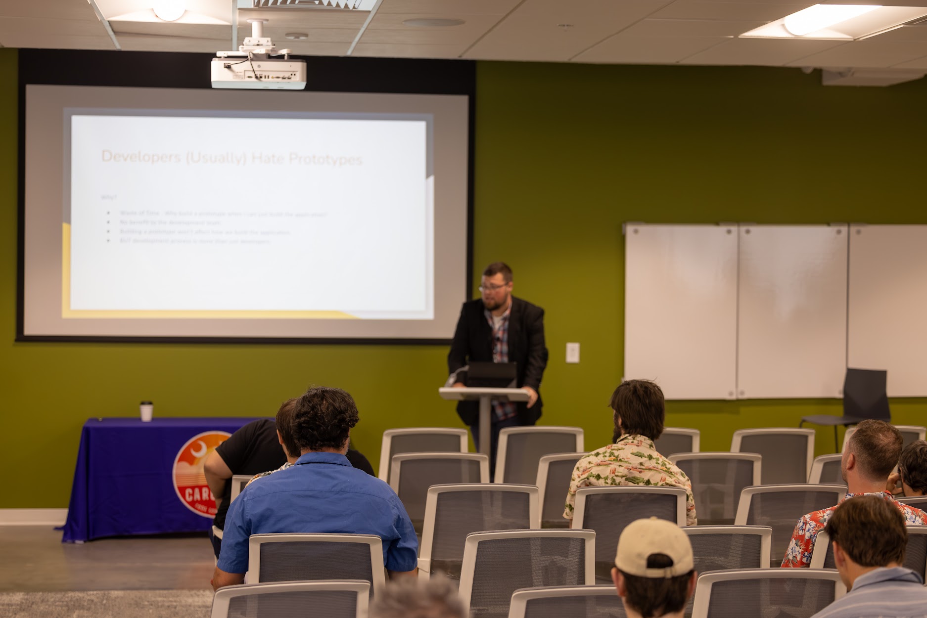 Jake Hennett speaking at the 2024 Carolina Code Conference