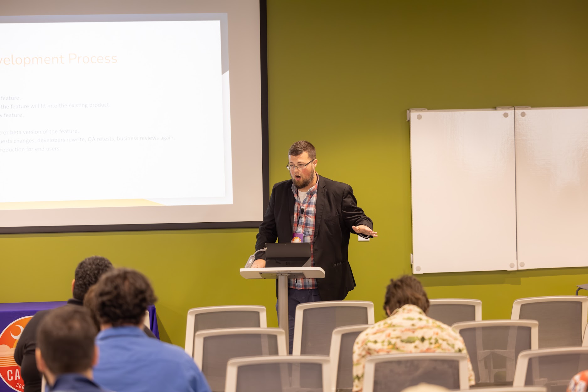 Jake Hennett speaking at the 2024 Carolina Code Conference