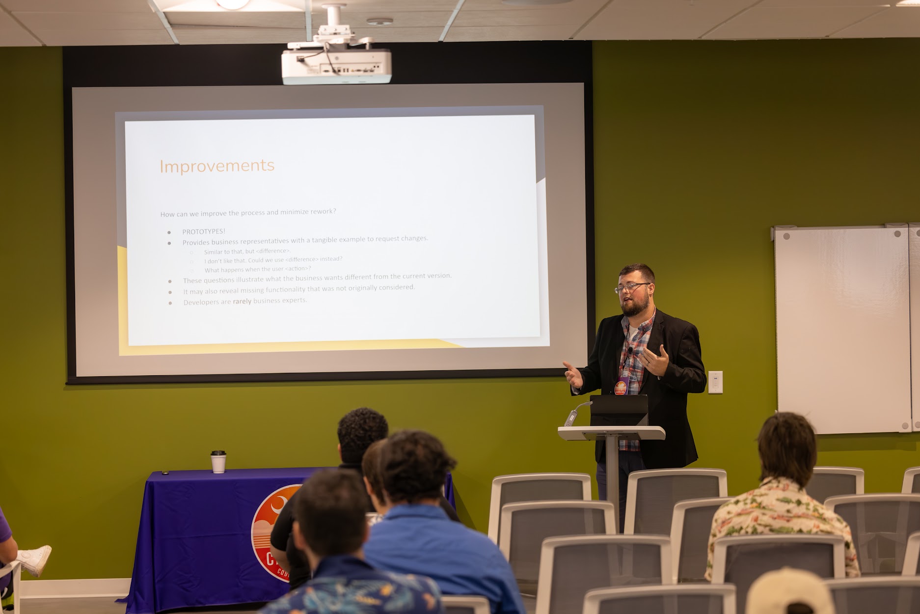 Jake Hennett speaking at the 2024 Carolina Code Conference