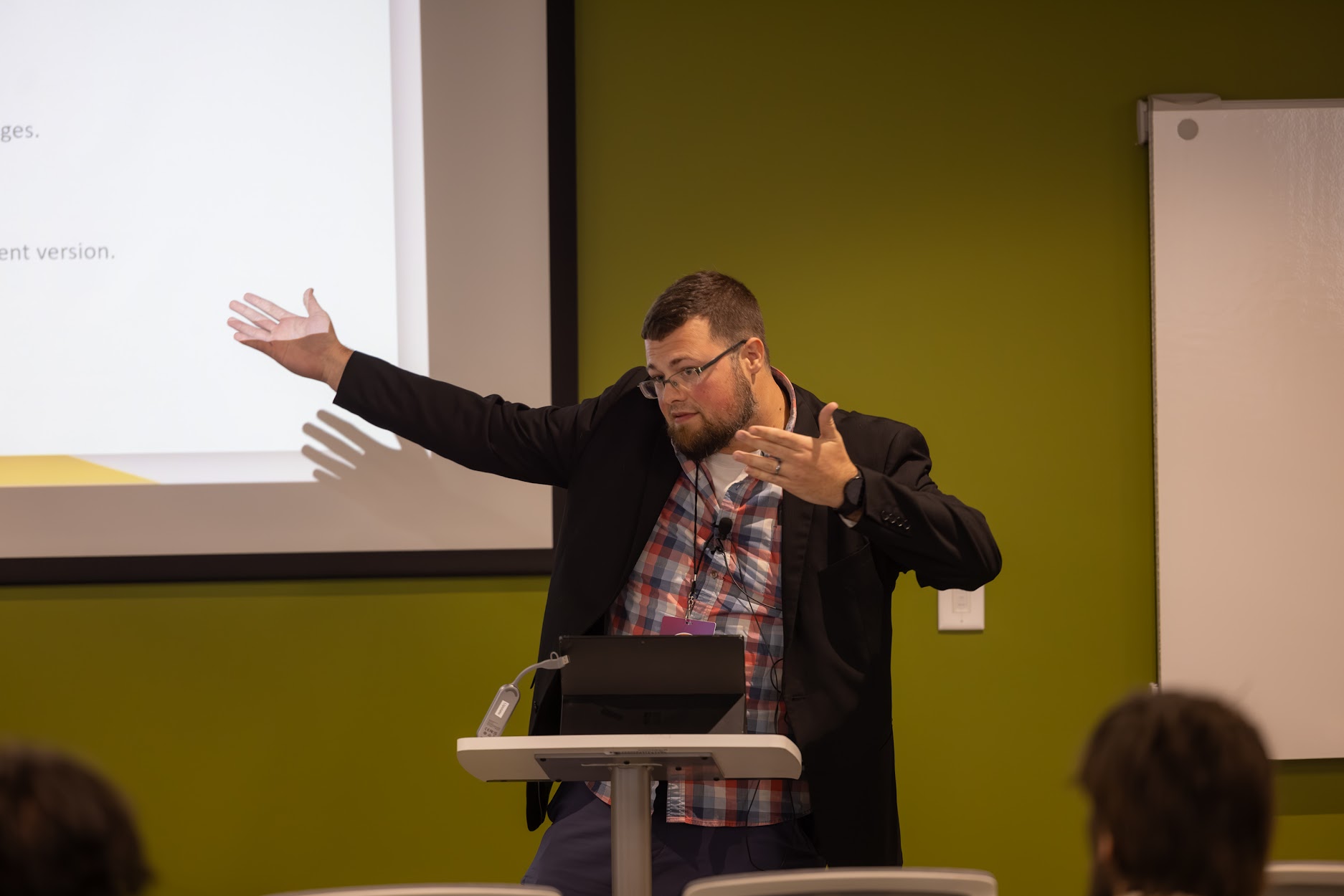 Jake Hennett speaking at the 2024 Carolina Code Conference