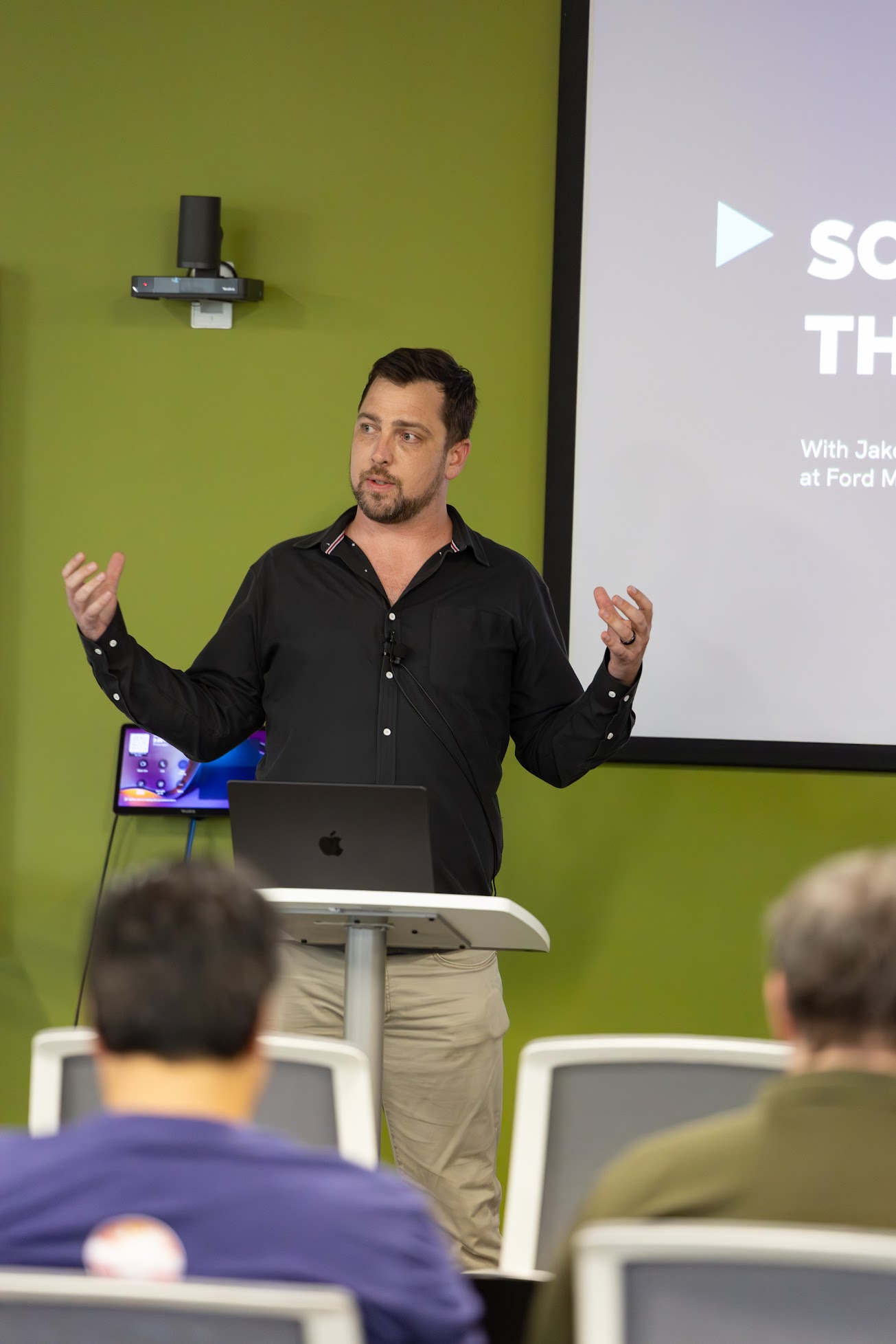 Jake Hendley speaking at the 2025 Carolina Code Conference